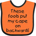 inktastic These Fools Put My Cape on Backwards Baby Bib by Inktastic