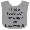inktastic These Fools Put My Cape on Backwards Baby Bib by Inktastic