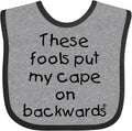 inktastic These Fools Put My Cape on Backwards Baby Bib by Inktastic